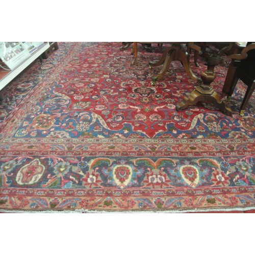 134 - Multi coloured ground Persian Kasham carpet of traditional floral medallion design 379-275cm