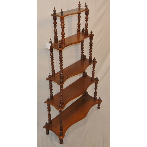 67 - Victorian style four tier whatnot with serpentine shaped shelves & turned columns