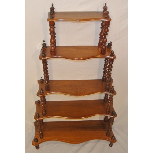 67 - Victorian style four tier whatnot with serpentine shaped shelves & turned columns