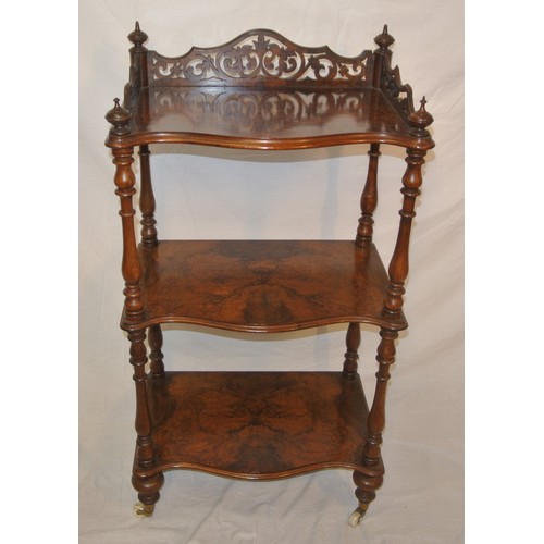 61 - Victorian walnut three tier serpentine fronted whatnot with pierced gallery, turned finials & column... 