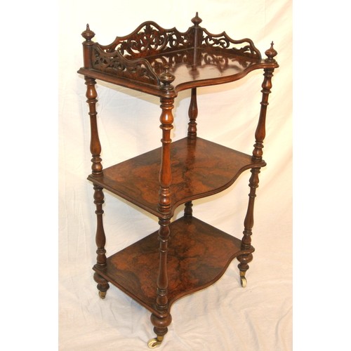 61 - Victorian walnut three tier serpentine fronted whatnot with pierced gallery, turned finials & column... 