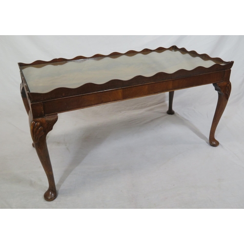 16 - Edwardian mahogany oblong coffee or occasional table with wavy border, glass inset, on cabriole legs... 