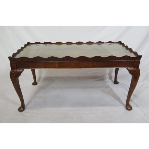 16 - Edwardian mahogany oblong coffee or occasional table with wavy border, glass inset, on cabriole legs... 