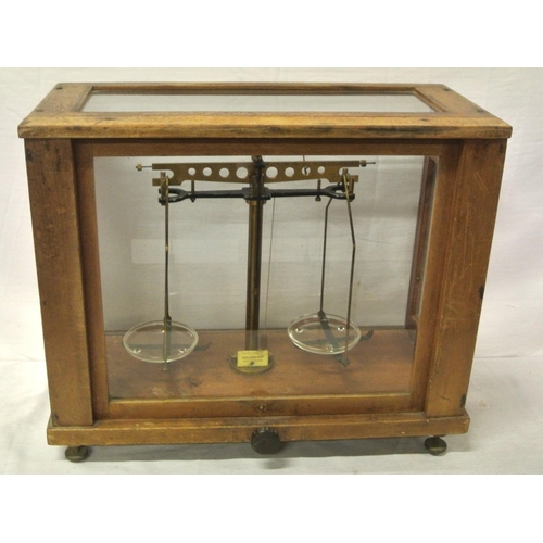 48 - Gallenkamp brass & metal weighing scales, glazed case, with adjustable legs