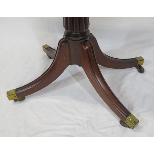 100 - Victorian mahogany tea table with swivel fold-over top, raised on reeded turned column, on splayed t... 