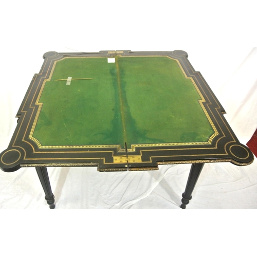 125 - French Empire style ebonised card table with fold-over top, brass inlay, 'dog-ear' candle corners, r... 