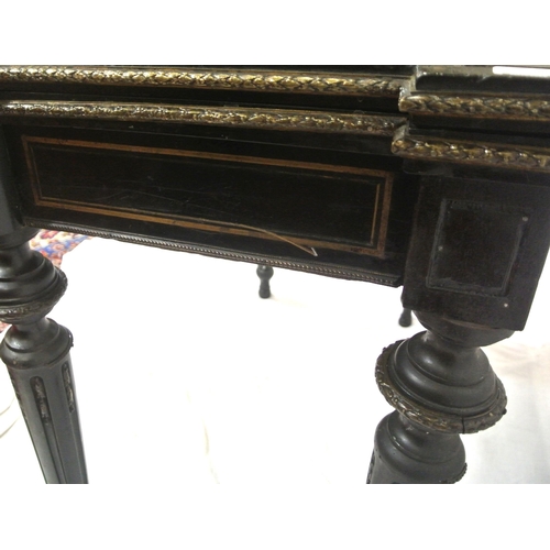 125 - French Empire style ebonised card table with fold-over top, brass inlay, 'dog-ear' candle corners, r... 