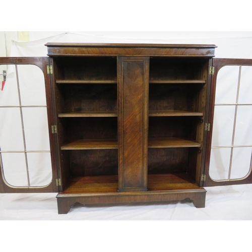 15 - Edwardian style mahogany bookcase with glazed doors, adjustable shelving, on bracket feet