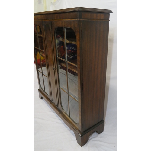 15 - Edwardian style mahogany bookcase with glazed doors, adjustable shelving, on bracket feet