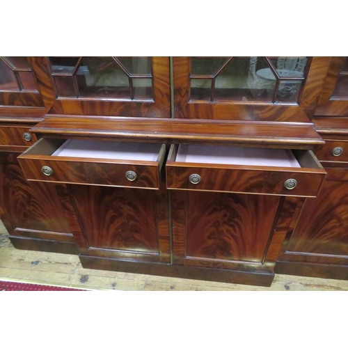 180 - Edwardian mahogany breakfront bookcase with dentil frieze, astragal glazed doors with shelved interi... 