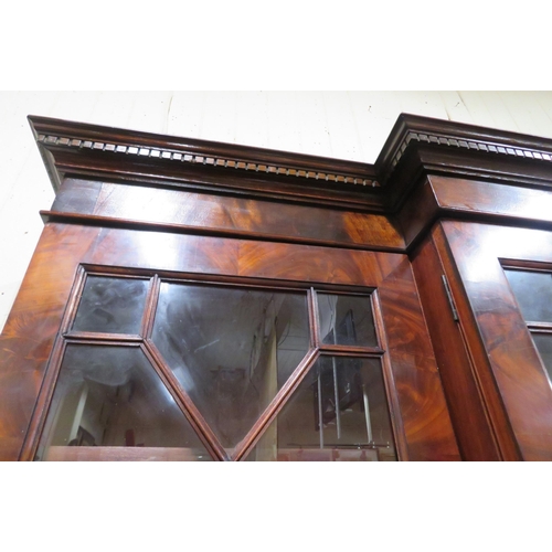 180 - Edwardian mahogany breakfront bookcase with dentil frieze, astragal glazed doors with shelved interi... 