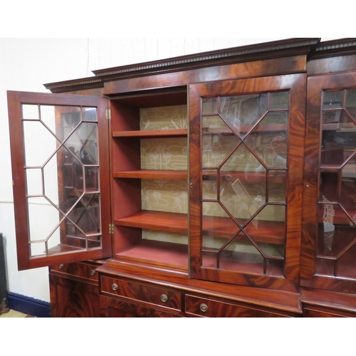 180 - Edwardian mahogany breakfront bookcase with dentil frieze, astragal glazed doors with shelved interi... 