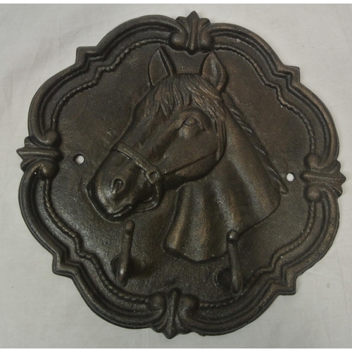 24 - A star shaped wall plaque with horse decoration