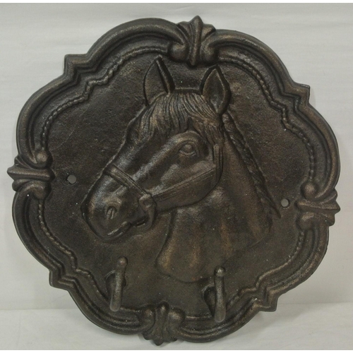 24 - A star shaped wall plaque with horse decoration