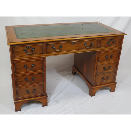 35 - Edwardian yew pedestal desk with leatherette top & six side drawers with drop handles, on bracket fe... 