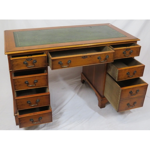 35 - Edwardian yew pedestal desk with leatherette top & six side drawers with drop handles, on bracket fe... 