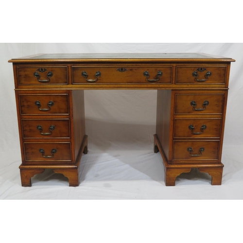 35 - Edwardian yew pedestal desk with leatherette top & six side drawers with drop handles, on bracket fe... 