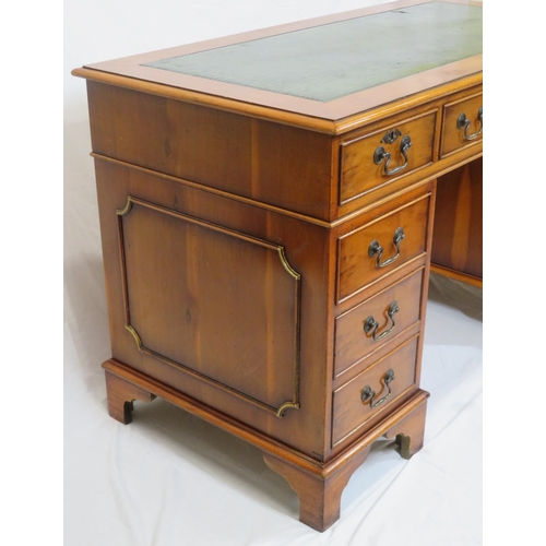 35 - Edwardian yew pedestal desk with leatherette top & six side drawers with drop handles, on bracket fe... 