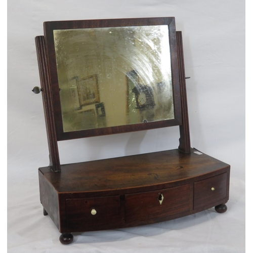 38 - Edwardian mahogany swivel mirror with reeded columns, bow fronted base with three drawers