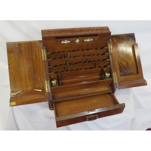 47 - Edwardian walnut stationery box with fold-out front & lid, lined interior, inkwells, drawer under wi... 