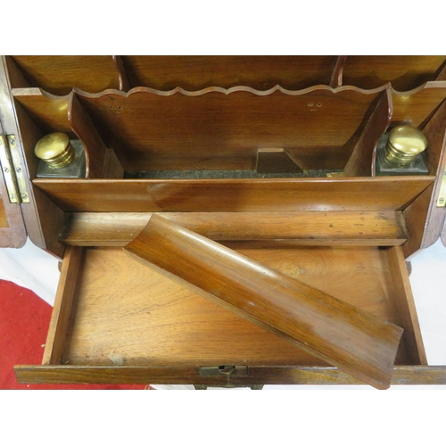 47 - Edwardian walnut stationery box with fold-out front & lid, lined interior, inkwells, drawer under wi... 