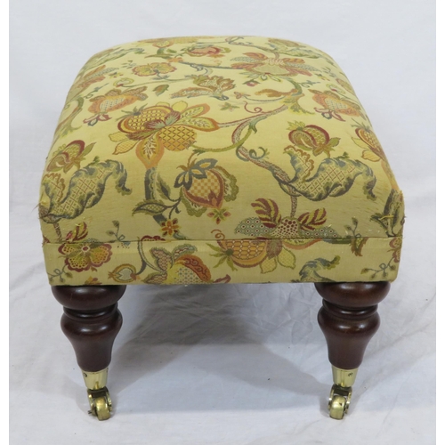 73 - Victorian design stool with foliate upholstery, turned tapering legs with castors