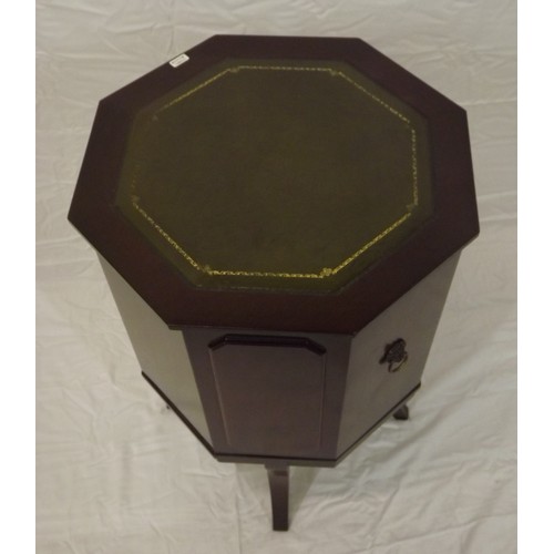 22 - Edwardian style hexagonal shaped cabinet with leatherette inset, drop handles, on shaped legs