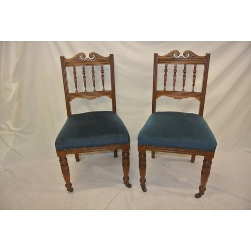 301 - Pair of Edwardian occasional chairs with shaped railed backs, upholstered seats, turned legs with ca... 