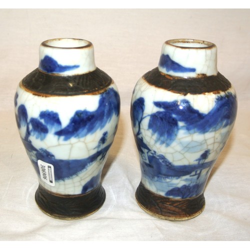 167 - Pair of Oriental baluster shaped blue & white scenic decorated bud vases