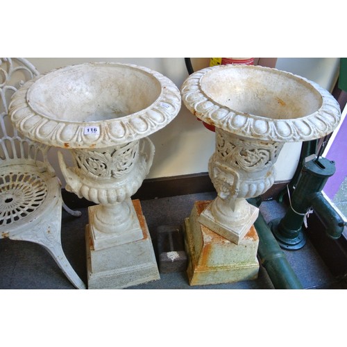 179 - Pair of Victorian style cast iron campana shaped garden vases with ribbed socles, shaped handles, sq... 