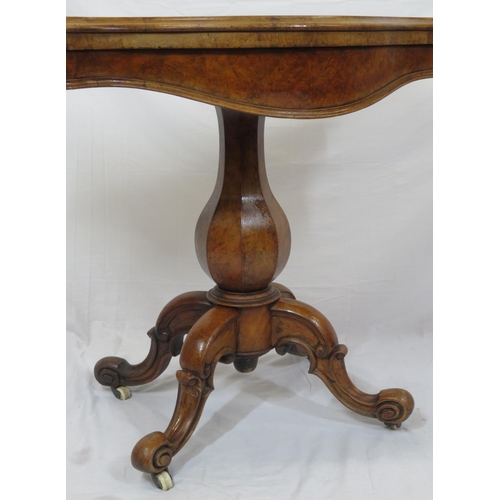 220 - Victorian walnut card table with serpentine shaped sides, swivel fold-over top, hexagonal baluster c... 