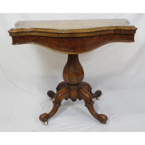 220 - Victorian walnut card table with serpentine shaped sides, swivel fold-over top, hexagonal baluster c... 