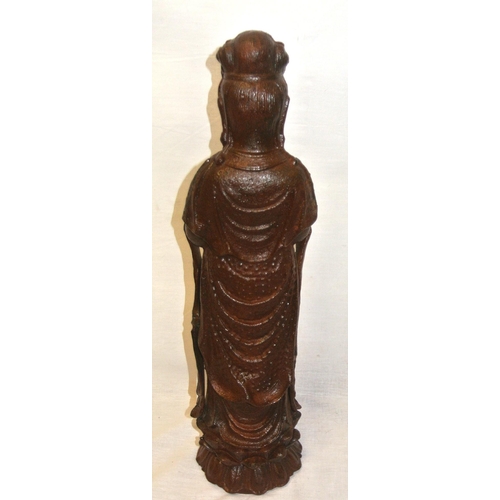 293 - Oriental metal figure of a man holding a vase, on shaped base