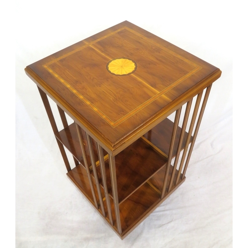 104 - Edwardian style inlaid & crossbanded mahogany revolving bookcase with railed sides, shell inlay, on ... 