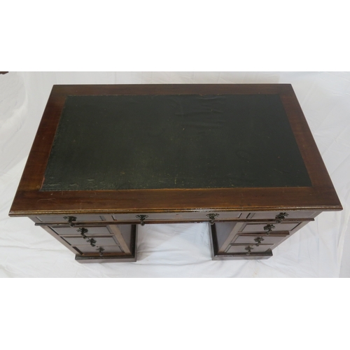 120 - Edwardian style pedestal desk with two frieze drawers, six side drawers, teardrop handles, plinths