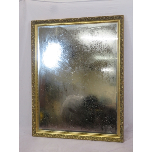 133 - Large gilt framed bevelled glass wall mirror with foliate & beaded decoration 130x100cm