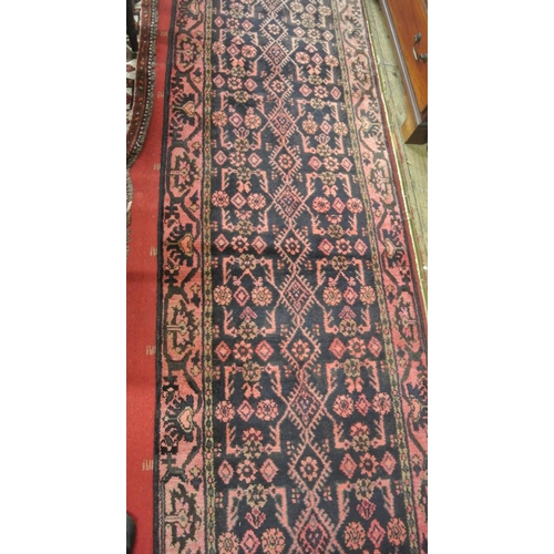 137 - Deep ground Iranian runner with all over pattern with hints of pink and surrounding border 295 X 85 ... 