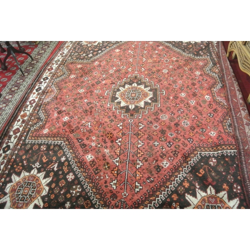 146 - Washed red ground Persian Kashqai Nomadic carpet with traditional design 296 X 225 cm