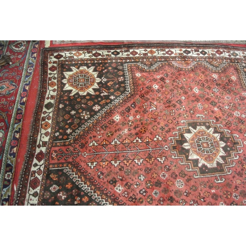 146 - Washed red ground Persian Kashqai Nomadic carpet with traditional design 296 X 225 cm