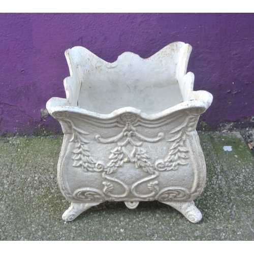 188 - Pair of cast iron garden planters with wavy rims, foliate decoration & shaped legs