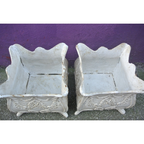 188 - Pair of cast iron garden planters with wavy rims, foliate decoration & shaped legs