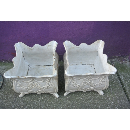 188 - Pair of cast iron garden planters with wavy rims, foliate decoration & shaped legs