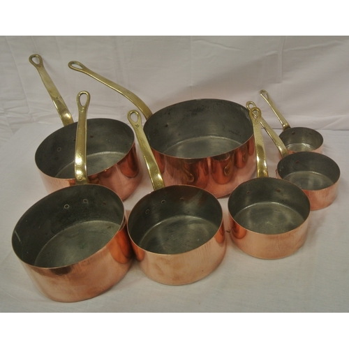 198 - Set of six copper pans with shaped brass handles