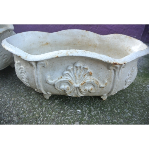 204 - Pair of oval cast iron garden planters with foliate decoration