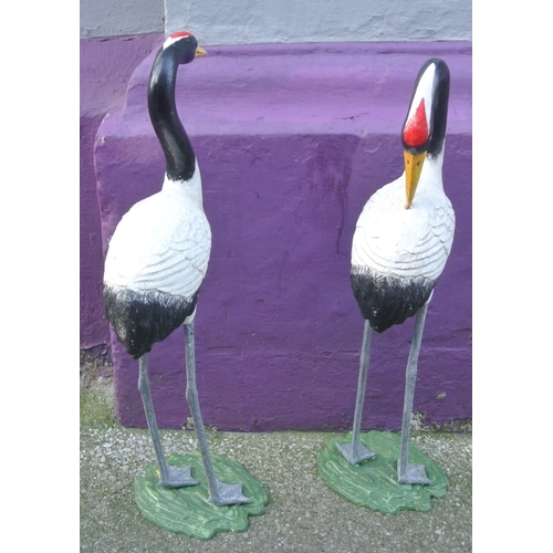 209 - Pair of metal crane figures on shaped bases