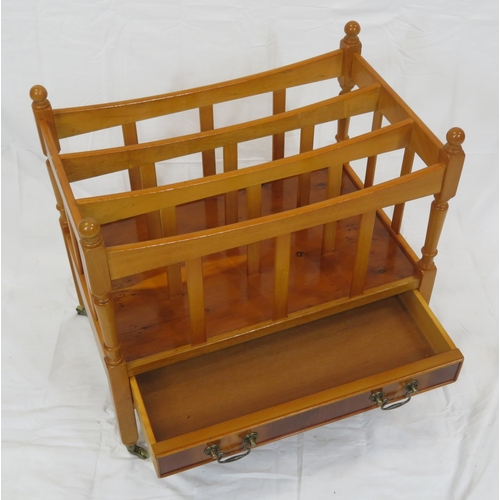 219 - Edwardian style yew three section canterbury with shaped rails, turned columns, drawer with brass dr... 