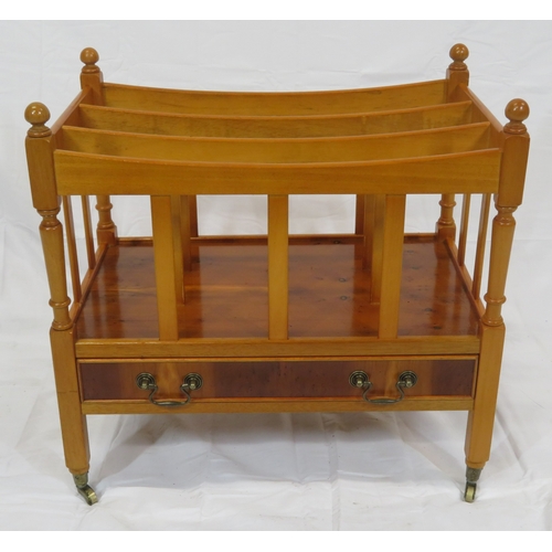 219 - Edwardian style yew three section canterbury with shaped rails, turned columns, drawer with brass dr... 