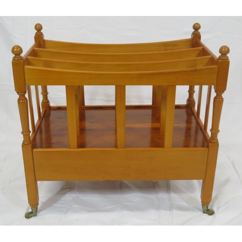 219 - Edwardian style yew three section canterbury with shaped rails, turned columns, drawer with brass dr... 