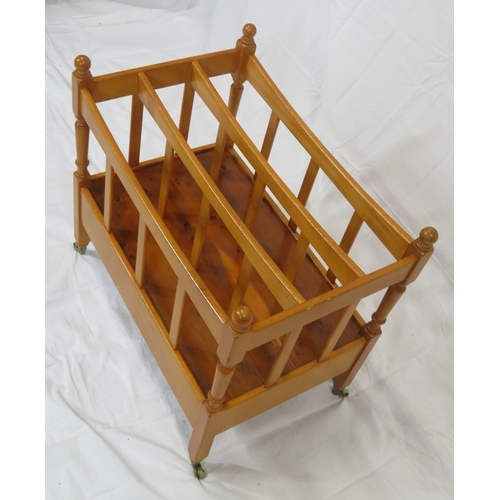 219 - Edwardian style yew three section canterbury with shaped rails, turned columns, drawer with brass dr... 