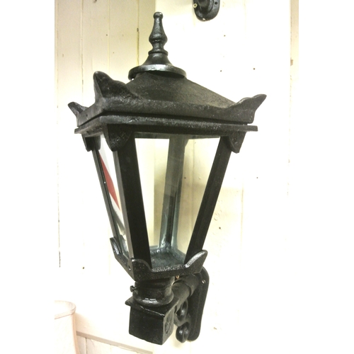 284 - Pair of cast iron garden lamp holders with angled sides